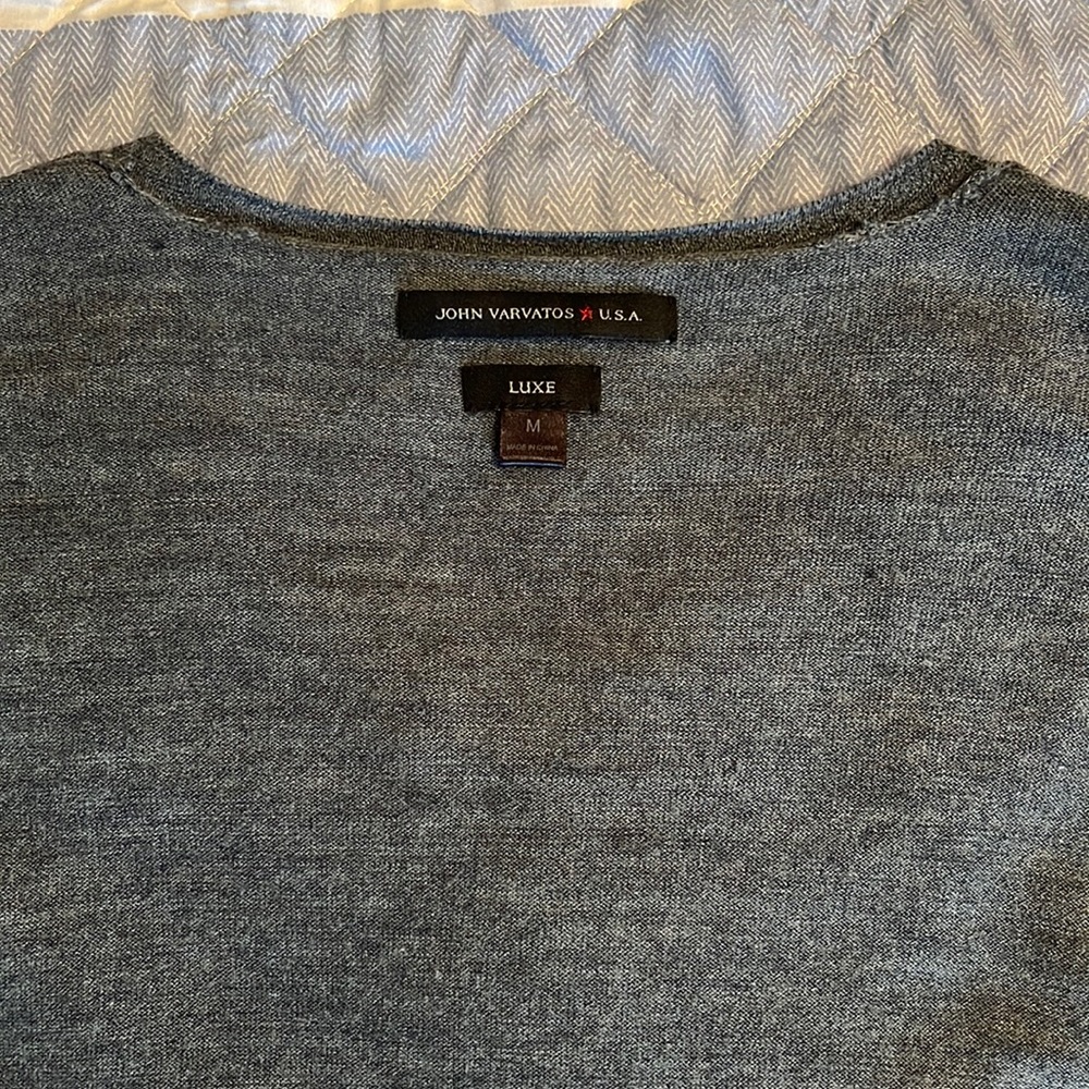 John Varvatos, really thin sweater gray with no wear at all.  Size medium